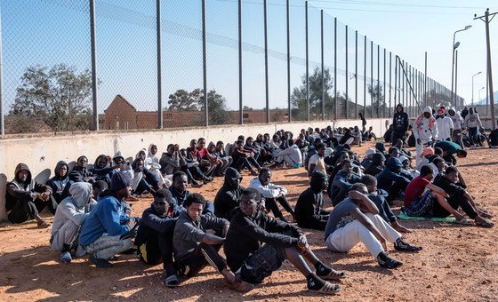 Migrants sit in the courtyard of a detention centre in Libya. (file)